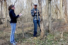 NKU environmental science student Katie Ollier records data with fellow student Luke Freeman.
